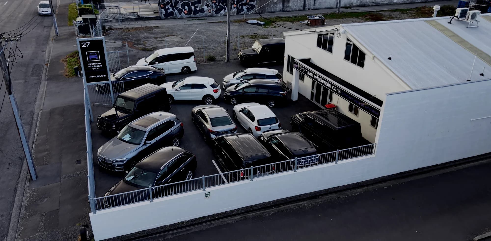 Exterior of Premium Wholesale Cars at 27 Watts Road, Sockburn, Christchurch, at dusk
