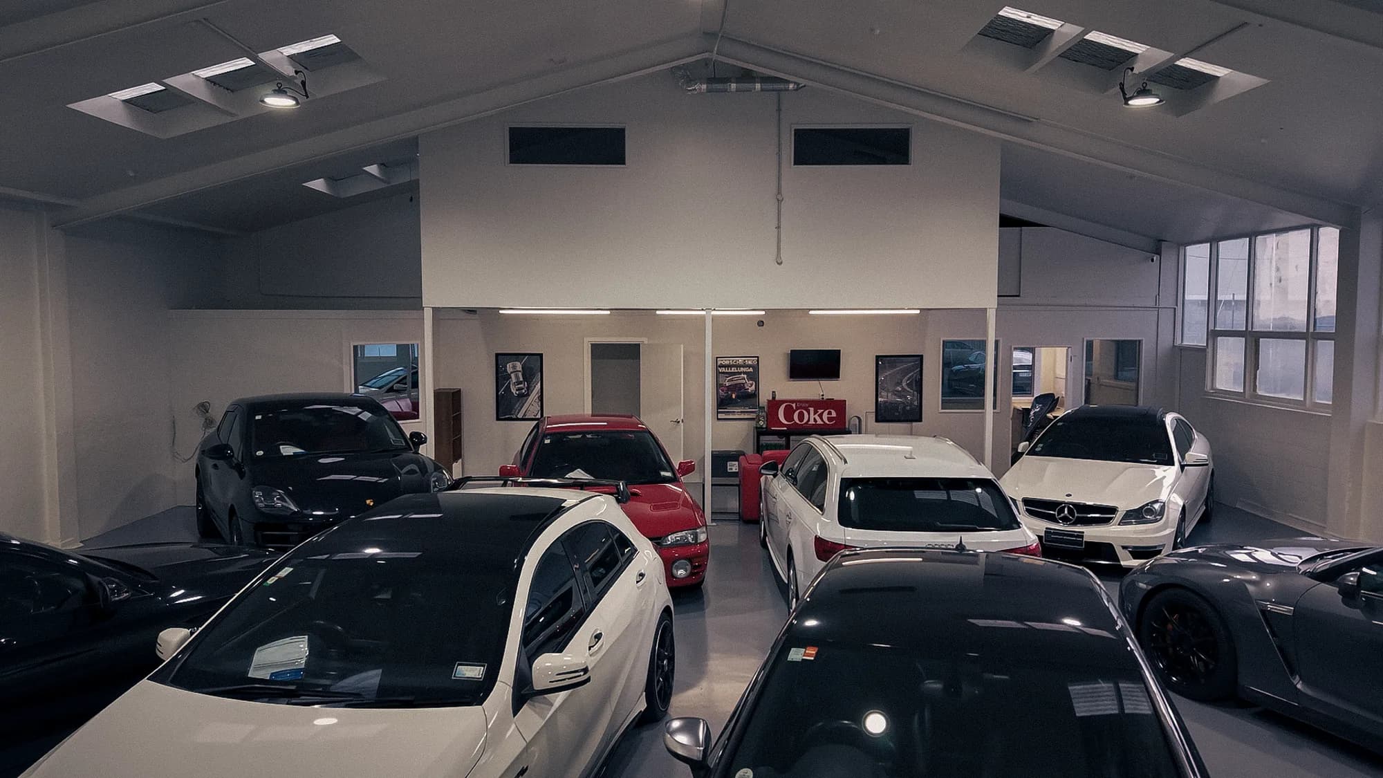 Wide interior view of the Premium Wholesale Cars showroom at 27 Watts Road, Sockburn
