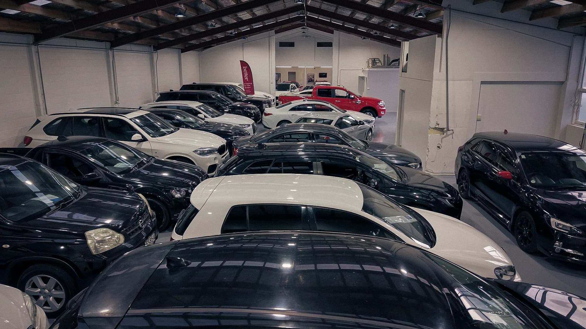 Range of vehicles displayed under the vaulted showroom roof at PWC Sockburn